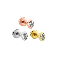 three pairs of gold and silver studs with diamonds on the top, two in different colors