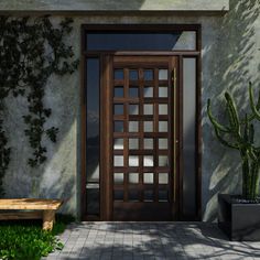 a wooden door sitting next to a green plant