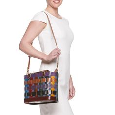 You're sure to love the colorful and unique style of this AmeriLeather basket-style handbag. You're sure to love the colorful and unique style of this AmeriLeather basket-style handbag. HANDBAG DETAILS 9"H x 5.5"W x 12.5"L Removable/adjustable crossbody strap Shoulder strap length: adjusts to 44 in. Adjustable handles Handle: 5.5'' drop Water repellent Copper-tone hardware Zipper closure Interior: 2 slip pockets, 1 zip pocketCONSTRUCTION & CARE Body: canvas/leather Wipe clean Imported Size: One Multicolor Satchel Bucket Bag, Multicolor Leather Crossbody Bucket Bag, Leather Bucket Bag With Braided Handles In Basket Shape, Multicolor Tote Bucket Bag, Casual Multicolor Satchel For Shopping, Multicolor Leather Satchel Bucket Bag, Multicolor Bucket Satchel With Adjustable Strap, Multicolor Satchel-shaped Bucket Bag, Multicolor Satchel Bucket Bag For Daily Use