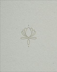 a white paper with a gold line drawing of a lotus flower on the front and side