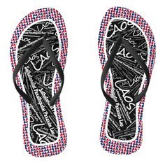 a pair of black and white flip flops with red, white, and blue patterns