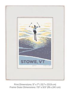 a white frame with an image of a skier