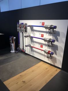 there is a display with different types of tools on the wall and in front of it