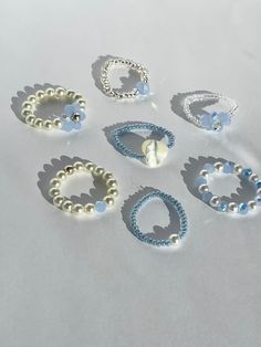 (items are shipped between 1-2 days)   Cute beaded stretchy rings made with blue beads and/ or pearls 💗I recommend avoiding water and keeping it stored away when not being worn to maintain its quality. Pearl Beaded Ring, Preppy Seed Bead Rings, Ring Ideas With Beads, Aesthetic Bead Rings, Aesthetic Beads Ring, Cute Seed Bead Rings, Cute Diy Rings, Bracelets Handmade Beaded Diy Jewelry, Blue Bead Bracelet Ideas