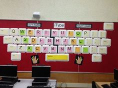 there are two laptops sitting on the desk with keyboard keys attached to each one