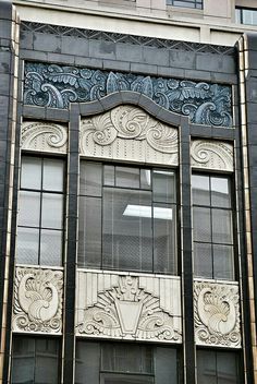 an art deco style window on the side of a building