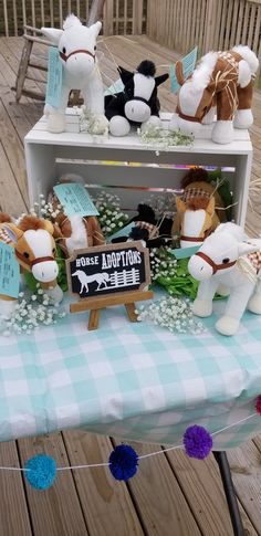 several stuffed animals are sitting on a table