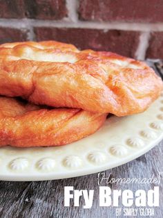 two croissants on a white plate with the words fry bread written below