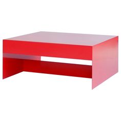 a red coffee table sitting on top of a white floor