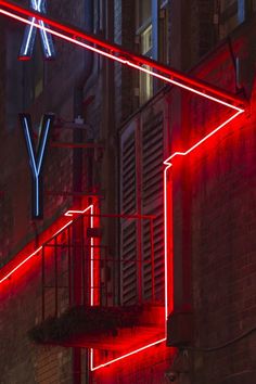 red neon lights on the side of a building