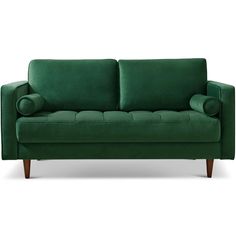 a green couch sitting on top of a white floor