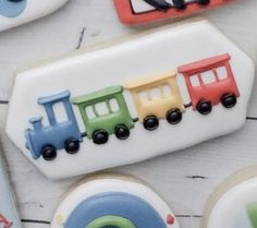 decorated cookies with trains and cars on them