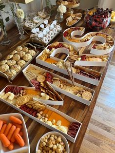 a table filled with lots of different types of snacks and desserts on top of it