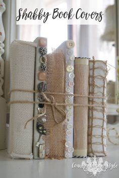 the shabby book covers are stacked on top of each other with buttons and pearls