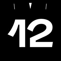 a black and white clock with the number twelve twenty two in it's center