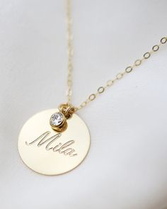 Have this custom necklace personalized with your child's name, your name, initialsor any meaningful word of your choice.This necklace is perfect for a special meaningful keepsake gift for mom, friendwife or that special someone. Gold filled or Sterling Silver Disc charm measures 19mm in diameter Cubic Zirconia measures approc. 4mm Necklace For Mom Personalized, Customized Necklace Names, Personalized Necklace Names, Personalized Jewelry For Mom, Personalized Gold Necklace, Creative Jewelry Photography, Baby Necklace, Necklace For Mom, Family Necklace