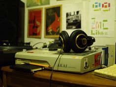 headphones sitting on top of a computer keyboard