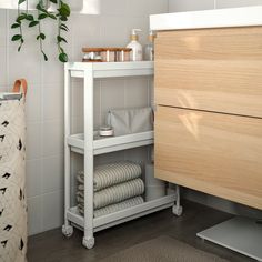 the bathroom is clean and ready to be used as a storage area for towels or toiletries