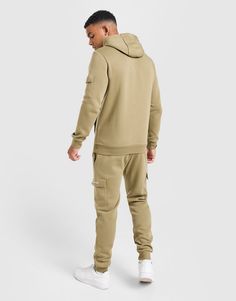 Match up in a JD-exclusive look with this men's Essential Cargo Tracksuit from McKenzie. In an Olive colourway, this regular-fit suit is made from a soft cotton-polyester fabric for all-day comfort. The pullover hoodie has ribbed trims, a drawcord-adjustable hood and a kangaroo pouch, while the joggers feature a quick-tie waistband, cuffed hems and open hand pockets. Finished off with cargo flap pockets and classic McKenzie branding. Machine washable. | Our model is 6'1" with a 39" chest and wears a size medium. Cargo Tracksuit, Nike React Vision, 270 Nike, Cotton Polyester Fabric, Football Training, Back To School Shopping, Fitted Suit, Kangaroo Pouch, Mens Essentials