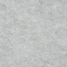 an image of a white background that looks like felt or wool with some stains on it