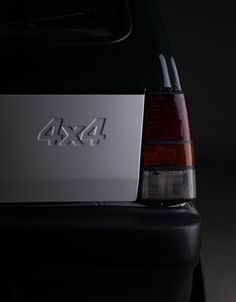 the back end of a car with an ax4 logo on it