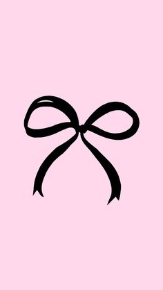 a black bow on a pink background