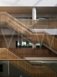 the inside of a building with wooden stairs