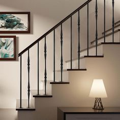 a lamp sitting on top of a table next to a stair case