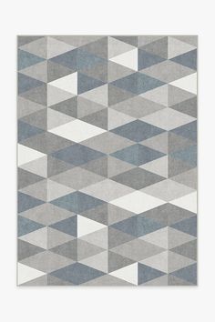 a rug with grey and white geometric shapes