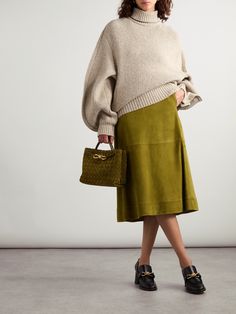 Bottega Veneta's midi skirt is pleated and split at the sides to give the A-line shape beautiful movement when you walk. It's made from panels of 'Marsh' suede and sits high on the waist. Suede Midi Skirt, Winter Work Wear, Exclusive Clothing, Designer Accessories, Green Skirt, Shearling Jacket, Dress And Heels, Clothes Collection, Elegant Outfit