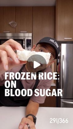 a man sitting at a kitchen counter eating food from a spoon with the words frozen rice on it