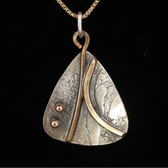 Vintage Donna Mcafee Sterling Silver Bronze Accent Modernist Pendant 18” Sterling Silver Box Chain Total Weight ~ 5grams Tested As .925 Sterling Silver Chain Width ~ 1mm Pendant Width ~ 21mm Pendant Height ~ 31mm Chain Length: ~ 18" This Donna Mcafee Artisan Pendant Is A Handmade Freeform Rounded Triangle With Bronze Accents. The Back Is Hand Engraved With Donna Mcafee's, Signature And The Year It Was Made “95” (1995). In 1978 Donna Mcafee Earned Her Master's Degre In Art Education. Nine Years L Unique Teardrop Necklace For Anniversary, Silver Teardrop Necklaces With Unique Variations, Artisan Nickel-free Necklace For Anniversary, Handmade Bronze Necklaces For Anniversary, Artistic Bronze Pendant Jewelry, Bronze Pendant Jewelry With Patina, Bronze Tarnish-resistant Pendant Jewelry, Bohemian Silver-plated Pendant Jewelry, Bronze Patina Pendant Necklace