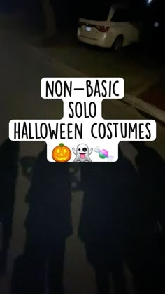 two people standing next to each other in front of a street sign that says non - basic solo halloween costumes