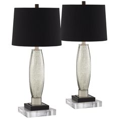 two clear glass table lamps with black shades