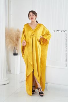 Yellow V-neck Maxi Dress For Wedding, Festive V-neck Wedding Kaftan, Gold V-neck Kaftan For Party, Festive V-neck Maxi Dress For Evening, Festive V-neck Satin Dresses, Elegant Yellow Kaftan For Eid, Gold Bohemian Kaftan For Wedding, Long Gold Dresses For Eid, Gold Long Dresses For Eid