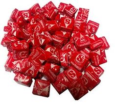 a pile of red and white candies sitting on top of each other