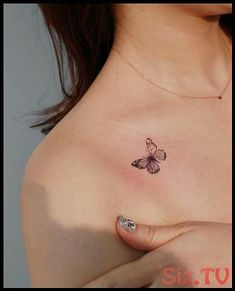 a woman's breast with a butterfly tattoo on her left shoulder and right breast