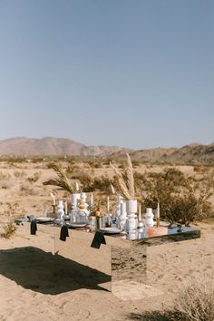 an outdoor table set up in the desert