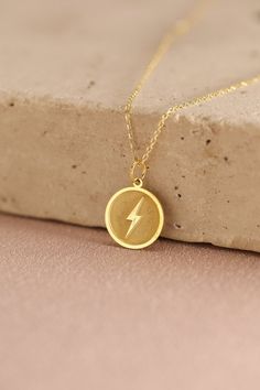 Gold Lightning Bolt Pendant - Lightning Gold Necklace ● Material of pendant: Solid Gold 14k ( REAL GOLD ) ● Metal Stamp: 14k ( REAL GOLD ) ● The pendant is available in 5 sizes: - 12,7 mm / 0.5 inches (Diameter) - 14,0 mm / 0,55 inches ( Diameter ) In the photos - 15,3 mm / 0.6 inches ( Diameter ) - 16,5 mm / 0,65 inches ( Diameter ) - 19,1 mm / 0,75 inches ( Diameter ) ( In the photos the size is 14mm / 0.55 inches Diameter ) ( Jump Ring inner diameter: 4 mm ) ● Material of chain: Solid gold 14 Yellow Gold Round Charm Necklaces For Birthday, Gold Charm Necklace With Round Pendant For Birthday, Gold Lightning, Gold Schmuck, Jewelry Birthday, Lightning Bolt, Jump Rings, Metal Stamping, Real Gold