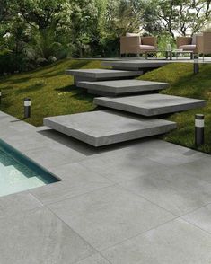 concrete steps leading up to a swimming pool