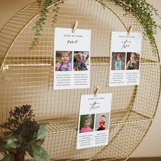 there are three pictures hanging on a wire rack with clothes pins attached to the strings