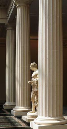 an image of a statue in the middle of columns