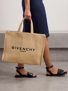 Woven from durable yet lightweight raffia, Givenchy's tote is perfect for trips to the beach. It's embroidered with the label's logo in black threads the front and has plenty of space inside to comfortably fit your wallet, water bottle, towel, sunscreen and a tablet. Givenchy Tote Bag, Ysl Tote Bag, Ysl Tote, Givenchy Logo, Summer Style Guide, Embroidered Tote Bag, Flat Dress Shoes, Embroidered Tote, Givenchy Paris