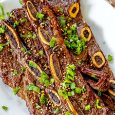 steak with herbs and seasoning on a white plate