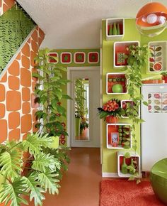 a green and orange hallway with plants on the wall