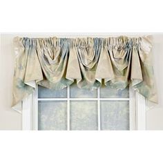 a window with curtains hanging on it's side and the curtain valance is open