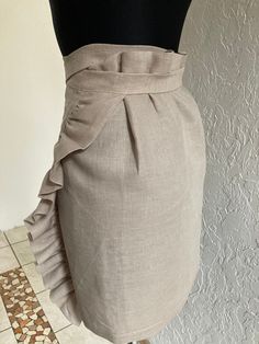 a mannequin wearing a skirt with ruffles on it