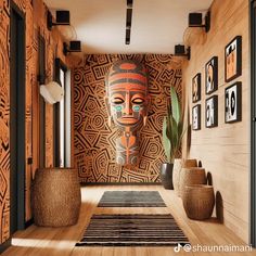 the hallway is decorated with african art and decorative wall hangings, along with potted cacti