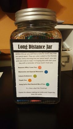 a jar filled with coins sitting on top of a table