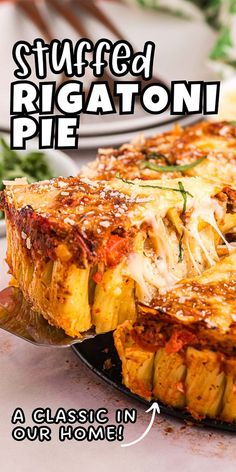 stuffed rigatoni pie on a plate with a serving spatula in front of it